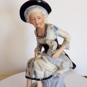 Vintage French porcelain figurine girl with sheep.